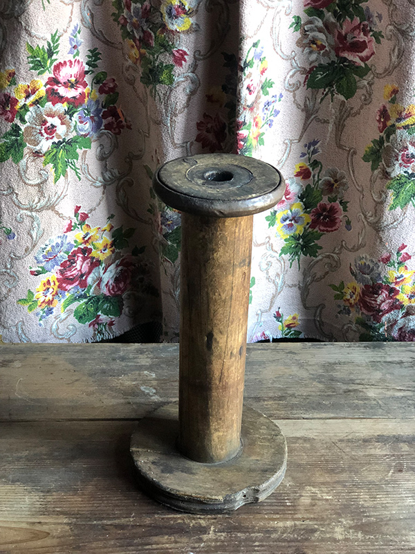 Tall wooden bobbin