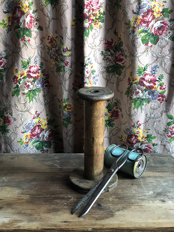 Tall wooden bobbin