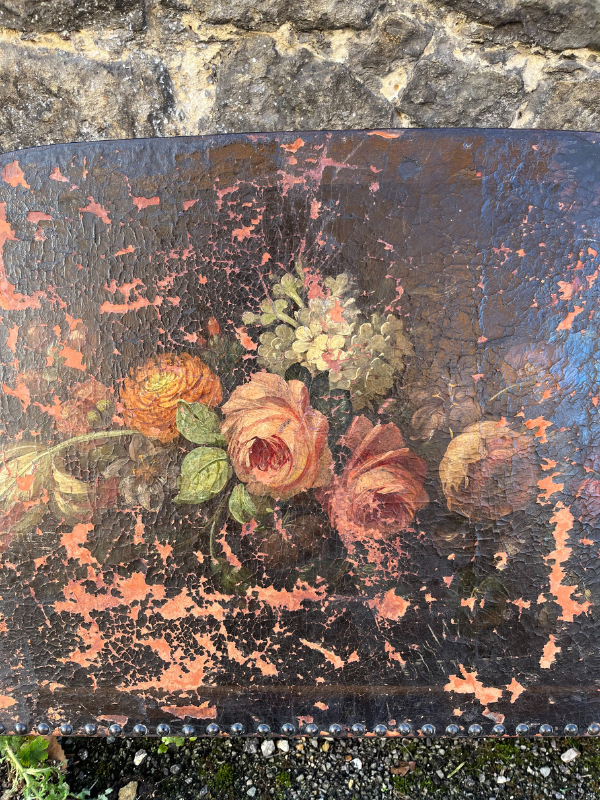 Close up of distressed & faded painted floral bouquet with pink on a brown leather background