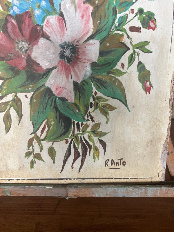 Close view of signature in the corner of a small floral painting