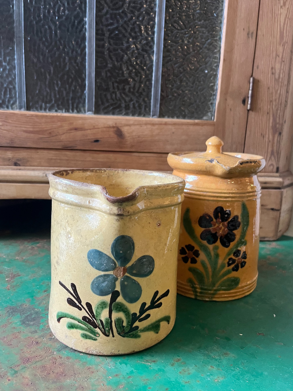 Pair of hand painted French jugs with flowers on the front