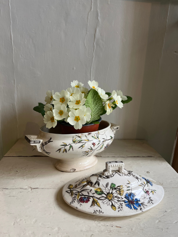 Vintage floral dish with painted lid in the foreground