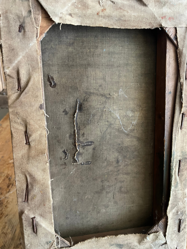 Reverse view of old canvas on an old wooden stretcher showing damage