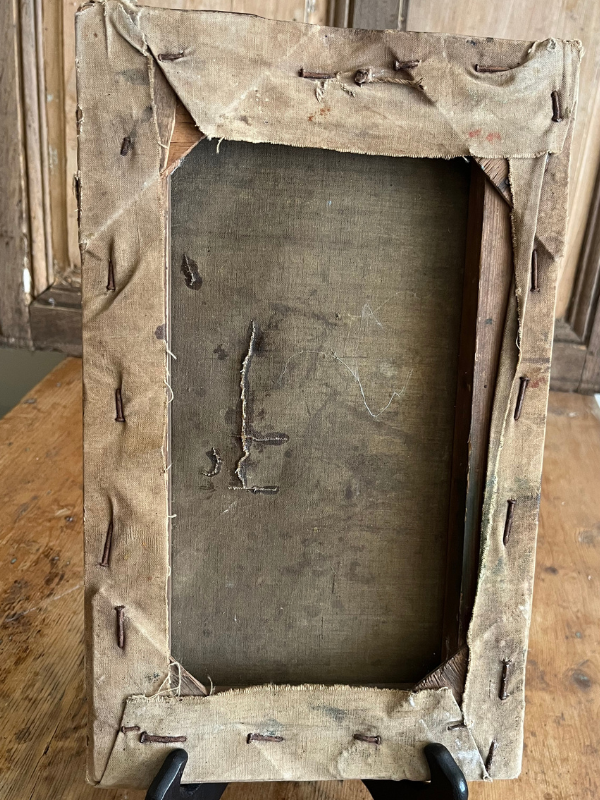 Reverse view of old canvas on an old wooden stretcher