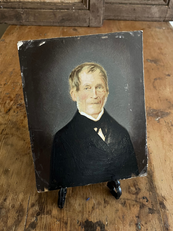 Small overpainted portrait of a Victorian gent on an easel